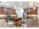Beautiful kitchen with granite countertops, stainless steel appliances, and wood cabinetry at 4770 Cypress Forest Ln, St Cloud, FL 34772