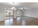 Open floorplan showcasing tile floors, access to the patio, and ceiling fans at 4770 Cypress Forest Ln, St Cloud, FL 34772