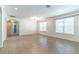 Large living room with tile flooring, chandelier, and lots of natural light from the windows at 4770 Cypress Forest Ln, St Cloud, FL 34772