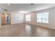 Open floor plan with tile flooring, arched entryway, and natural light from large windows at 4770 Cypress Forest Ln, St Cloud, FL 34772