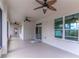 Spacious, screened-in covered patio featuring ceiling fans and wheelchair access for outdoor enjoyment at 4770 Cypress Forest Ln, St Cloud, FL 34772
