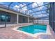 Beautiful private screened-in pool with brick pavers and ample space for outdoor lounging and recreation at 4770 Cypress Forest Ln, St Cloud, FL 34772