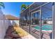 Screened-in pool area featuring a refreshing pool and patio with brick pavers at 4770 Cypress Forest Ln, St Cloud, FL 34772