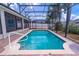 Inviting screened-in pool area with brick pavers and well-maintained landscaping for a serene backyard experience at 4770 Cypress Forest Ln, St Cloud, FL 34772