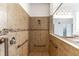 This accessible shower has safety bars, a handheld showerhead, and tiled walls at 4770 Cypress Forest Ln, St Cloud, FL 34772