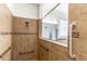 This accessible shower has safety bars, a handheld showerhead, and tiled walls at 4770 Cypress Forest Ln, St Cloud, FL 34772