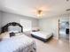 Sunlit bedroom showcasing tile floors and contemporary ceiling fan at 4792 Indian Gap Dr, Orlando, FL 32812