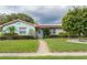 Charming single-story home with a well-maintained lawn, mature landscaping, and a welcoming entrance at 4792 Indian Gap Dr, Orlando, FL 32812