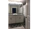 Bright bathroom with double vanity, modern fixtures, and coordinated shower curtain at 4949 Windermere Ave, Kissimmee, FL 34746