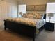 Well-lit bedroom showcasing a king bed, coordinated decor, and double door closet at 4949 Windermere Ave, Kissimmee, FL 34746