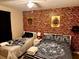 Charming bedroom with twin beds, decorative brick wall, and unique Harry Potter themed decor at 4949 Windermere Ave, Kissimmee, FL 34746