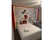 Cheerful bedroom with colorful Mickey Mouse wall art and twin beds at 4949 Windermere Ave, Kissimmee, FL 34746