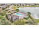 Aerial view of community pool with clubhouse and lake views at 5116 Sorrento W Blvd, St Cloud, FL 34771