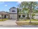 Charming two-story home with well-manicured landscaping, inviting curb appeal, and attached two car garage at 5116 Sorrento W Blvd, St Cloud, FL 34771