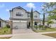 Charming two-story home with a well-manicured front yard at 5116 Sorrento W Blvd, St Cloud, FL 34771