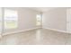 Bright bedroom with neutral walls, tile flooring and ample natural light at 514 Bristol Cir, Kissimmee, FL 34758