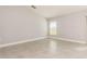 Spacious bedroom with tile flooring, baseboard trim and plenty of natural light at 514 Bristol Cir, Kissimmee, FL 34758