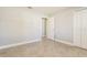 A well-lit bedroom features ceramic tile flooring and an ensuite bathroom at 514 Bristol Cir, Kissimmee, FL 34758