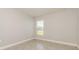 A spacious bedroom features a window to let in sunlight and ceramic tile flooring at 514 Bristol Cir, Kissimmee, FL 34758