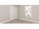 This bedroom features a window for natural light and a large closet for storage at 514 Bristol Cir, Kissimmee, FL 34758