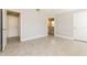 A well-lit bedroom features ceramic tile flooring, an ensuite bathroom and a large closet at 514 Bristol Cir, Kissimmee, FL 34758