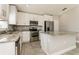 Beautiful eat-in kitchen with stainless steel appliances and bright white cabinets at 514 Bristol Cir, Kissimmee, FL 34758