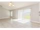 Bright and airy living room offering an eat-in kitchen and sliding glass door leading to the backyard at 514 Bristol Cir, Kissimmee, FL 34758