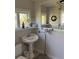 A bathroom with a vintage sink and a large mirror at 529 Hillside Nw Ave, Daytona Beach, FL 32118