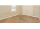 Neutral bedroom with beige carpeting, natural light, and a double door closet at 5543 Grey Hawk Ln, Lakeland, FL 33810