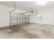 Spacious two-car garage with white walls and concrete floor at 5543 Grey Hawk Ln, Lakeland, FL 33810