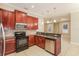 This kitchen features granite countertops, stainless appliances, tile backsplash and dark cabinets at 5543 Grey Hawk Ln, Lakeland, FL 33810