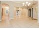 Large living area showcases tiled floors, striking columns, and a seamless open floor plan at 5543 Grey Hawk Ln, Lakeland, FL 33810