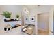 Well-lit bathroom with decorative shelves, granite countertop, and a mirror at 607 Black Eagle Dr, Groveland, FL 34736