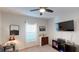 Neutral bedroom with a ceiling fan, carpet floors, and a window with blinds at 607 Black Eagle Dr, Groveland, FL 34736