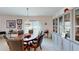 Formal dining area with stylish chandelier, dark wood table with leather chairs, and decorative display cabinets at 607 Black Eagle Dr, Groveland, FL 34736