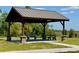 This gazebo features stone-based posts, benches and a metal roof at 607 Black Eagle Dr, Groveland, FL 34736