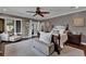 Spacious main bedroom with ensuite access, lots of light, and hardwood floors at 6115 Linneal Beach Dr, Apopka, FL 32703