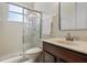 Clean bathroom featuring a glass-enclosed shower, marble countertops, and stylish fixtures at 6155 Hedgesparrows Ln, Sanford, FL 32771