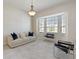 Bright living room with neutral palette, bay window, and modern furnishings at 6155 Hedgesparrows Ln, Sanford, FL 32771