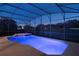 Inviting in-ground pool with integrated spa and screened enclosure at 6155 Hedgesparrows Ln, Sanford, FL 32771