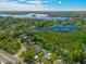 Wide aerial shot of the neighborhood including the lake and luxury homes at 640 Old Horatio Ave, Maitland, FL 32751