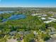 Drone eye view of the neighborhood including the lake and mature landscaping at 640 Old Horatio Ave, Maitland, FL 32751