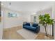 Upstairs loft with hardwood floors, neutral walls, a blue sofa and a decorative houseplant at 640 Old Horatio Ave, Maitland, FL 32751