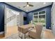 Home office with blue walls, a light wood desk, rug, chair and a view out the window at 640 Old Horatio Ave, Maitland, FL 32751