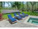 Relaxing backyard pool area featuring comfortable lounge chairs and a serene view at 640 Old Horatio Ave, Maitland, FL 32751