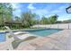 Backyard oasis featuring a stunning pool, in-pool loungers, and peaceful surroundings at 640 Old Horatio Ave, Maitland, FL 32751