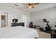 Comfortable bedroom featuring walk-in closet, a dark dresser, and a comfortable bed at 652 Orange Belt Loop, Winter Garden, FL 34787