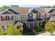 Aerial view of townhomes showcasing landscaped lawns and sidewalks at 652 Orange Belt Loop, Winter Garden, FL 34787