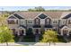 Aerial view of townhomes showcasing landscaped lawns and sidewalks at 652 Orange Belt Loop, Winter Garden, FL 34787