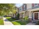 Charming townhomes featuring a well-manicured lawn and inviting entryways at 652 Orange Belt Loop, Winter Garden, FL 34787